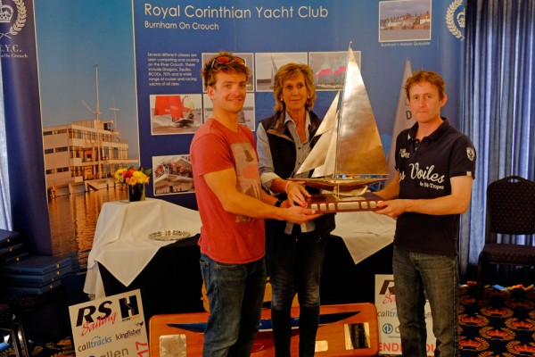 Annie Reid (RCYC Commodore) presents Ben Saxton (left) and Toby Lewis with the Endeavour Trophy